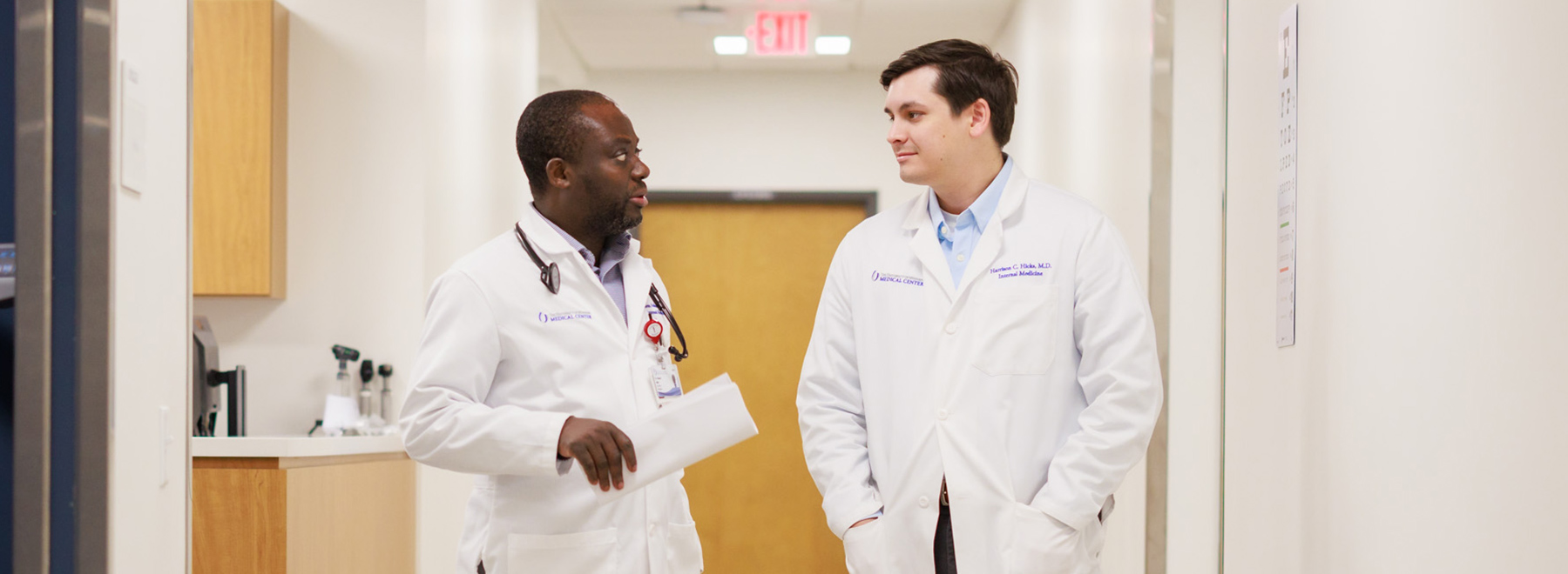 Residents converse in a UMMC Colony Park South hallway